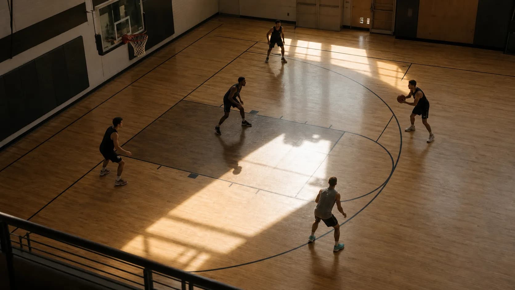 A high-angle view of five players spaced across a half-court possession